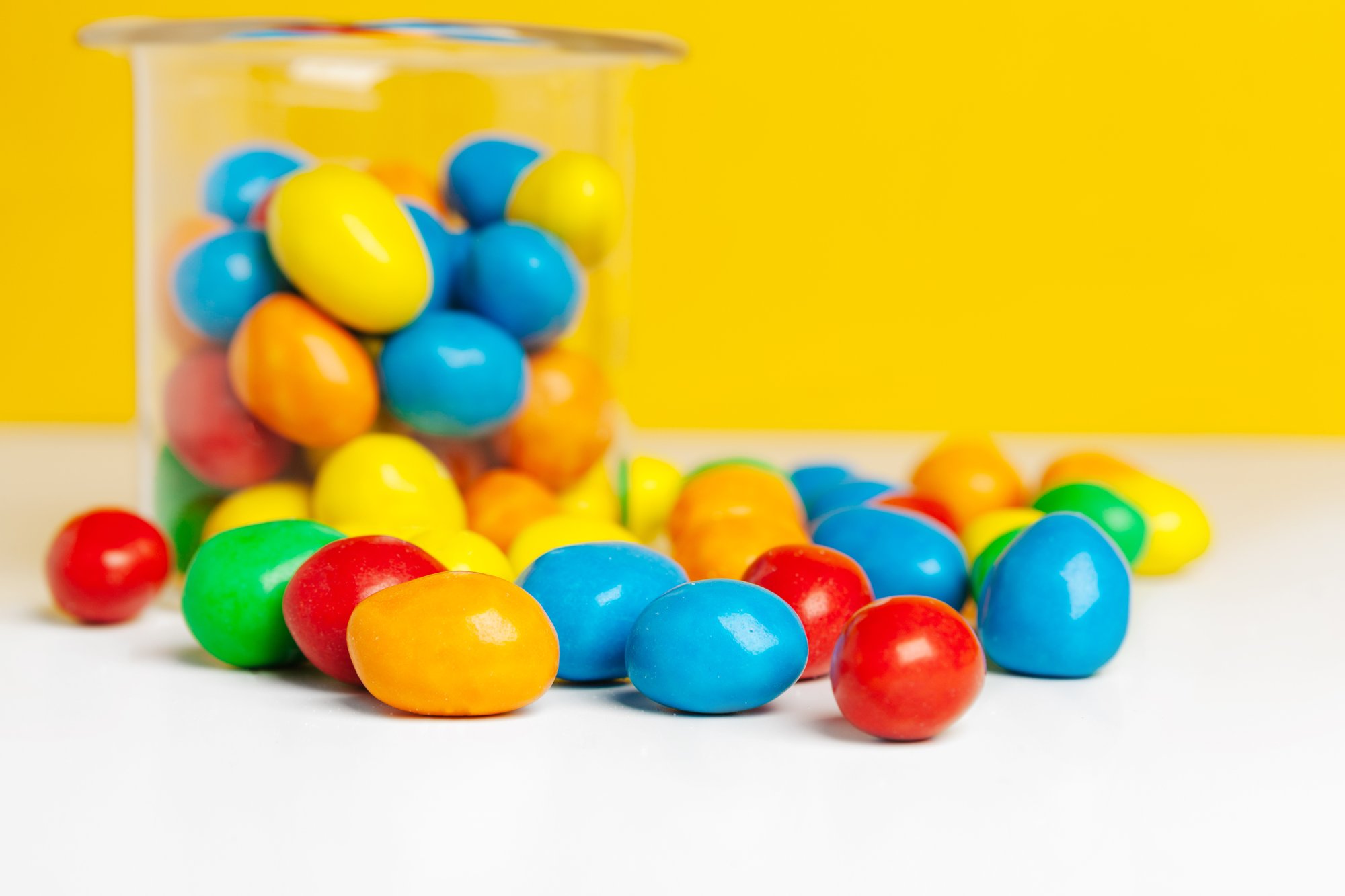 bottles-with-sweet-candies-on-table-creative-photo-2025-02-25-04-34-31-utc